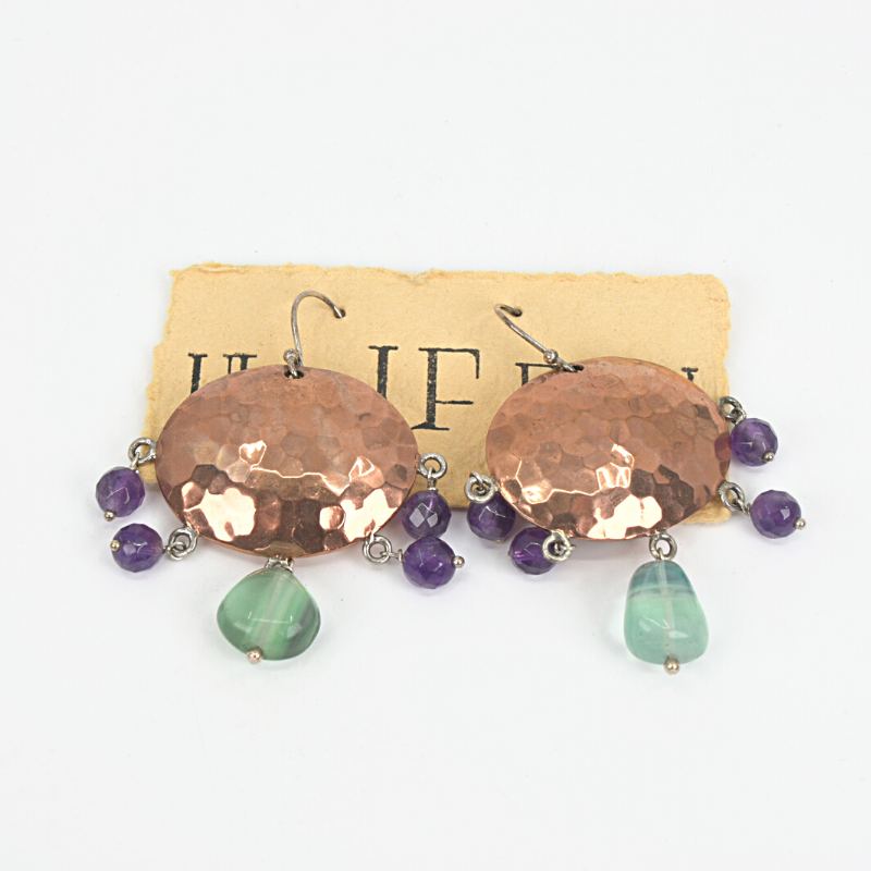 Hammered copper earrings with with fluorite and amethyst stones on sterling silver ear hooks. Designed and handcrafted by Ula Frou creator Sadie Hodson on Salt Spring Island.